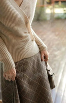 Designers' V-neck Wool Sweater with Asymmetrical Buttons